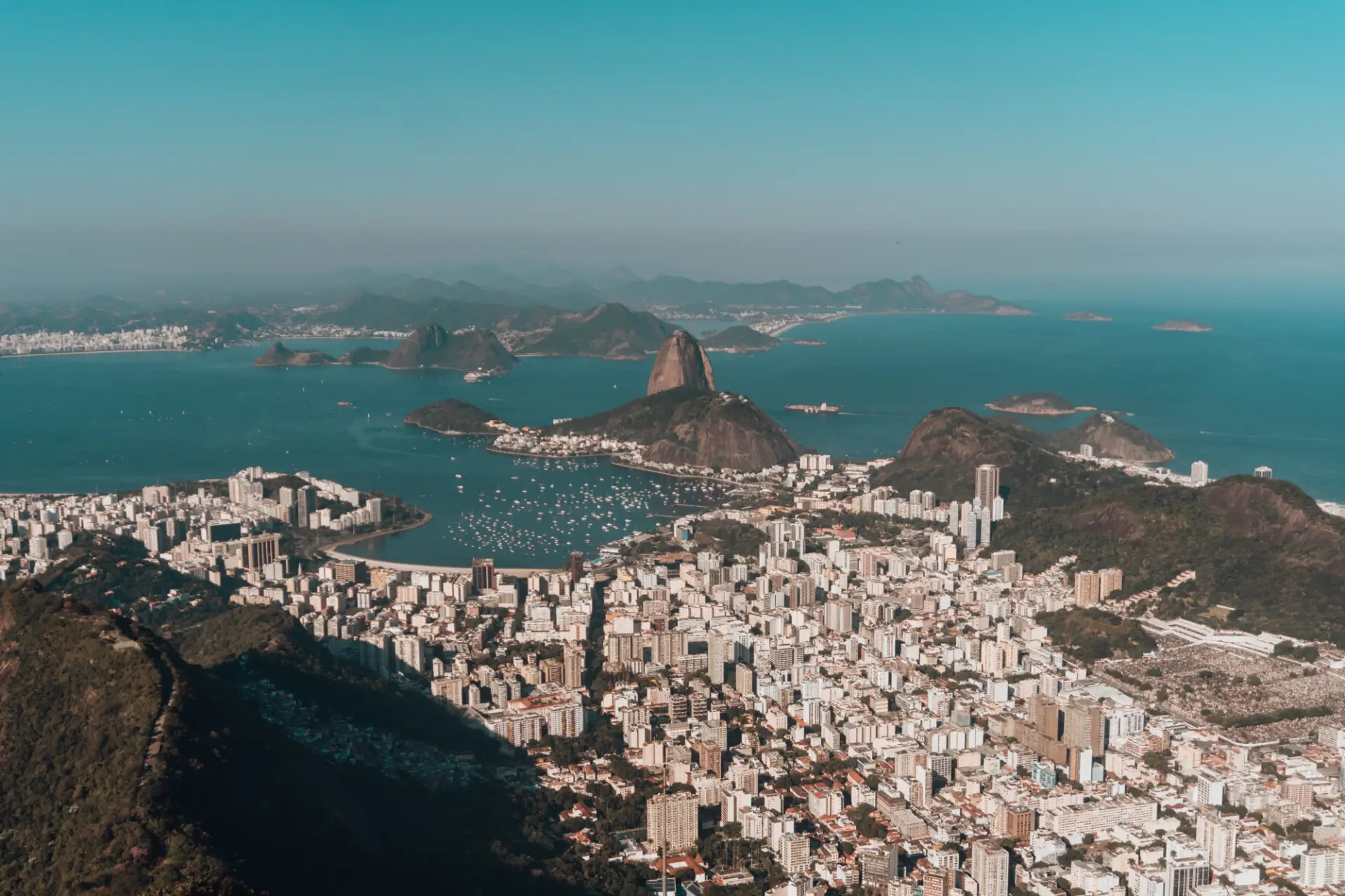 aerial-photo-rio-de-janeiro-surrounded-by-hills-sea-blue-sky-brazil